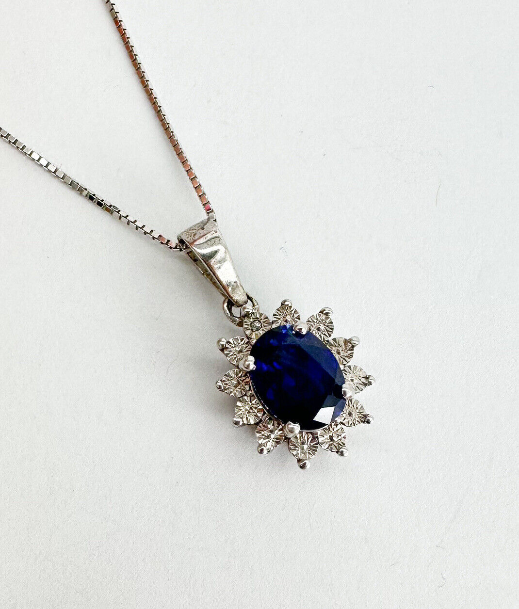 Zales Oval Blue Sapphire and 1/15 CT. T.w. Diamond Pendant in 10K White  Gold | CoolSprings Galleria